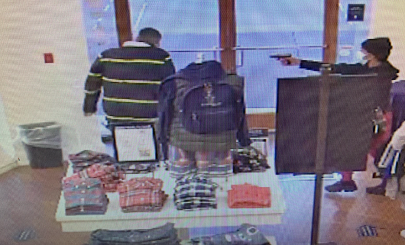 Oregon Polo Ralph Lauren store gunman caught on camera pointing gun at employee