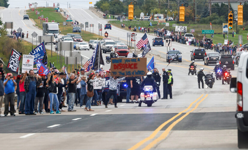 Biden faces hostile Michigan protesters as he arrives to promote stalling agenda