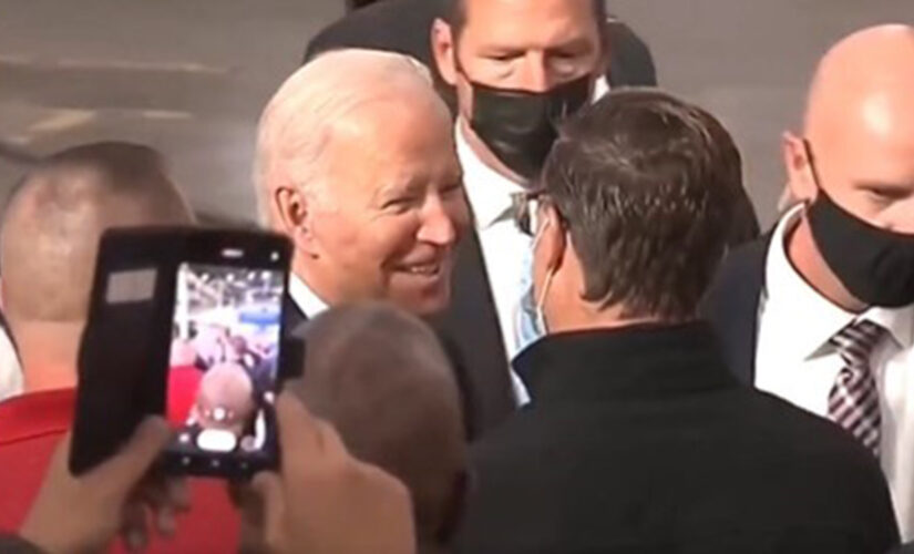 Biden shakes hands maskless but decides to put mask on before photo