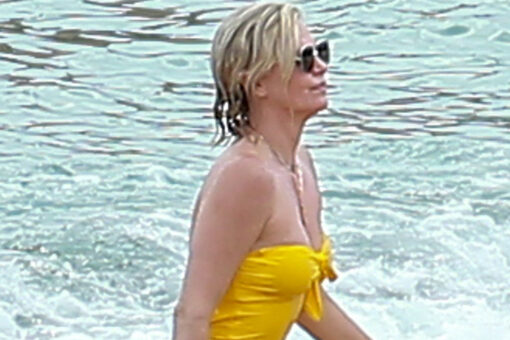 Charlize Theron stuns in yellow one-piece while being a responsible mom on vacation in Mexico