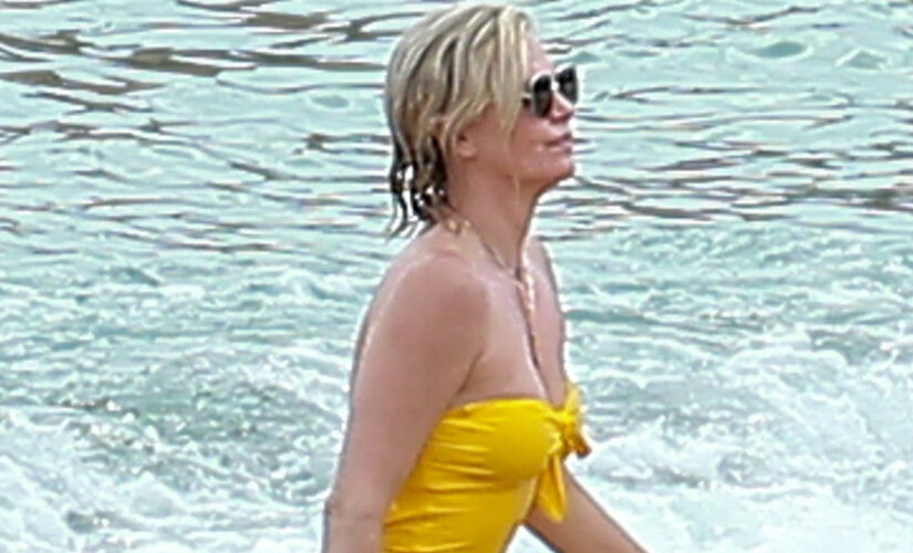 Charlize Theron stuns in yellow one-piece while being a responsible mom on vacation in Mexico