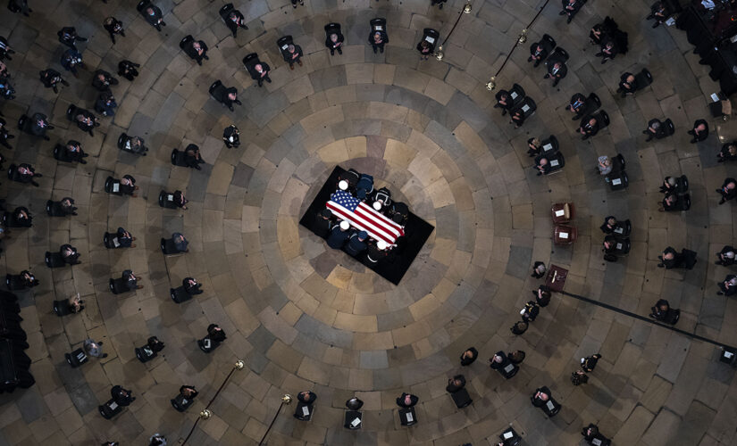 Bob Dole lies in state in Capitol Rotunda, where Biden, lawmakers pay tribute to &apos;giant of our history&apos;