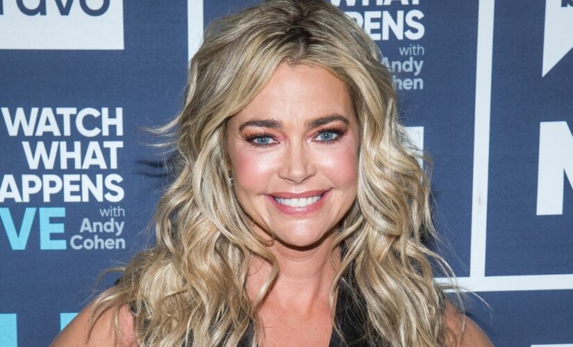 Denise Richards under fire going maskless on plane, wearing &apos;huge winter coat&apos; instead