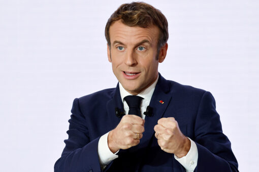 Macron defends his actions as he considers presidential race