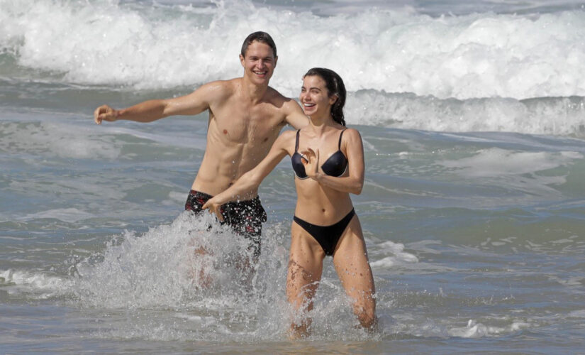 &apos;West Side Story&apos; actor Ansel Elgort makes a splash in Hawaii with girlfriend Violetta Komyshan