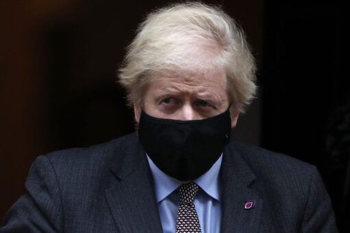 New UK mask rules start with Johnson under fire over parties