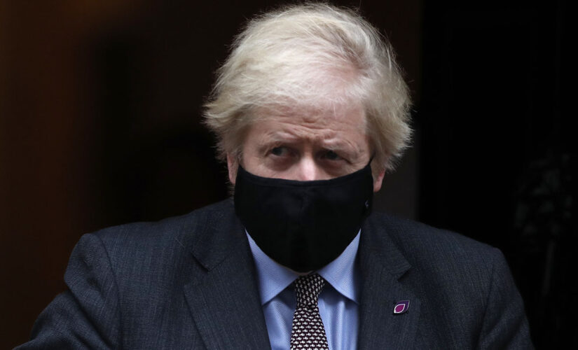 New UK mask rules start with Johnson under fire over parties