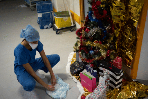 Surging COVID cases, ‘jingle jabs’ make for somber Christmas