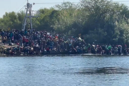 Border crisis: Video shows line of migrants crossing Rio Grande