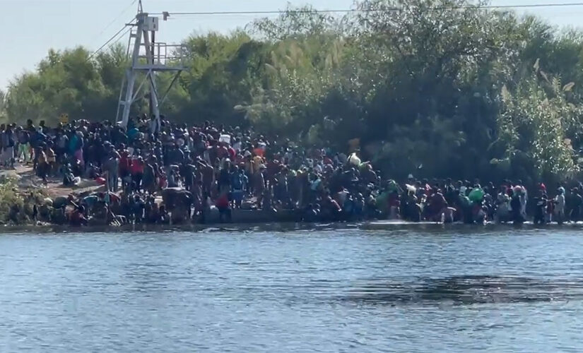 Border crisis: Video shows line of migrants crossing Rio Grande