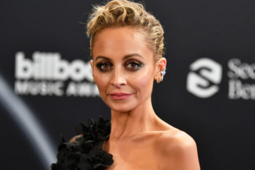 Nicole Richie stuns in golden gown for glamorous solo holiday shoot: &apos;My family forgot&apos;