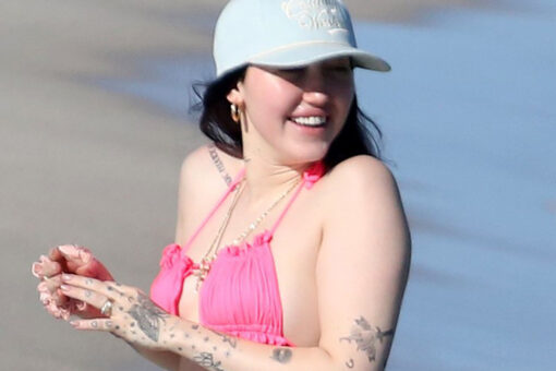 Noah Cyrus hits the beach in hot pink bikini ahead of sister Miley's New Year's Eve gig in Miami