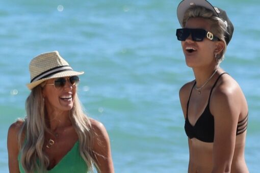 &apos;Real Housewives&apos; star Braunwyn Windham-Burke packs on PDA with new girlfriend during beach day in Miami