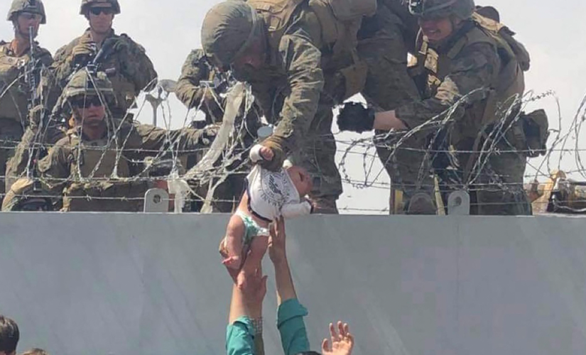 Afghan baby handed to US troops during evacuation chaos returned to family