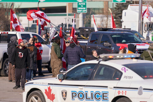 Ottawa police hand out fliers demanding Freedom Convoy protestors ‘leave the area now’