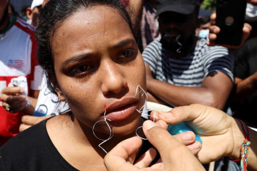 Migrants on Mexico’s southern border sew mouths shut as they demand passage to US
