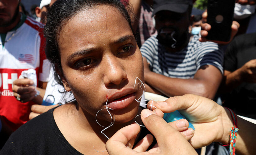 Migrants on Mexico’s southern border sew mouths shut as they demand passage to US