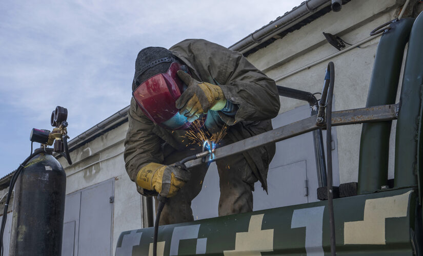 Ukrainian welders turn donated vehicles into army transport