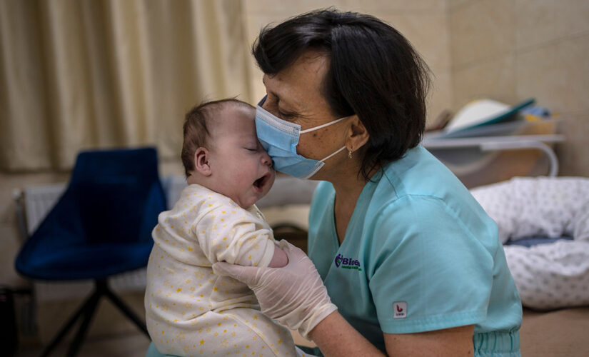 Surrogate babies born in Ukraine wait out war in basement