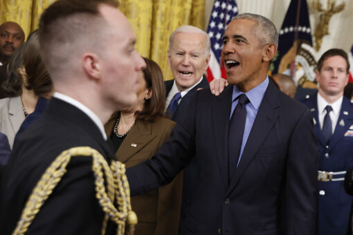 Biden looks on as Democrats gush over Obama at White House event