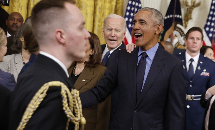 Biden looks on as Democrats gush over Obama at White House event