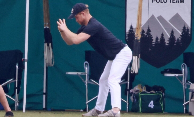 Prince Harry enjoys a deep stretch before a polo match in Santa Barbara