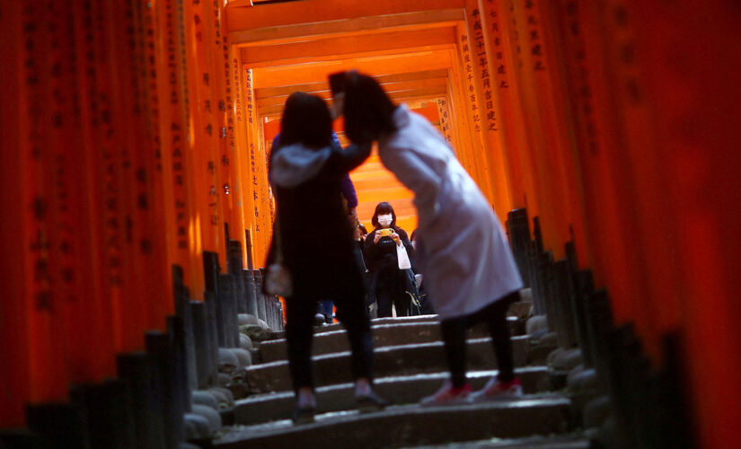 Japan to open to tourists after two years but only with masks, insurance, guides