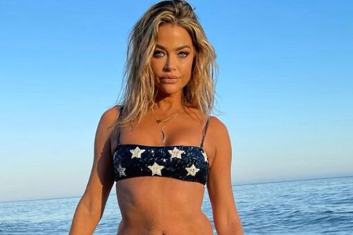 Denise Richards rocks patriotic bikini to celebrate July 4th on the beach after joining OnlyFans