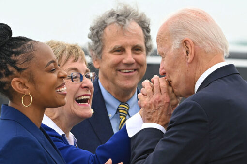 Democrat in one of nation’s most competitive races has unconventional campaign strategy: embrace Biden