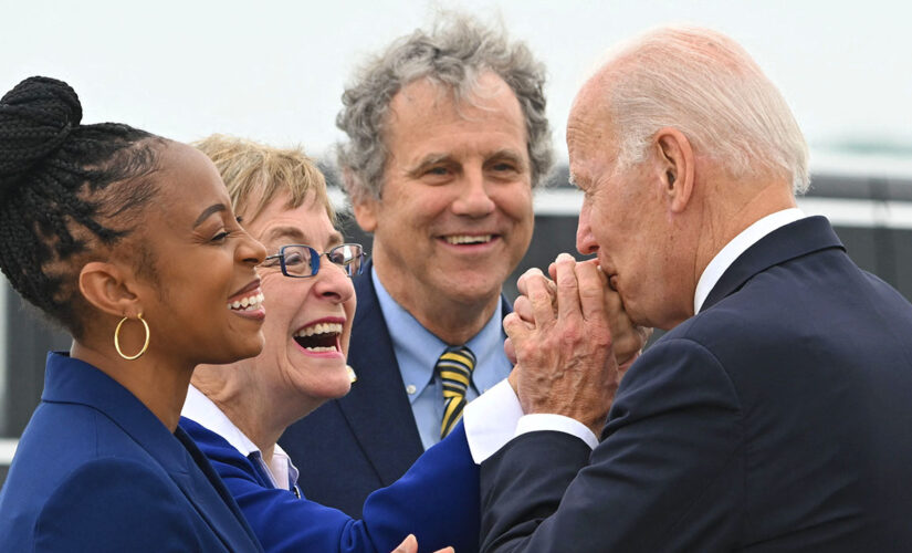 Democrat in one of nation’s most competitive races has unconventional campaign strategy: embrace Biden