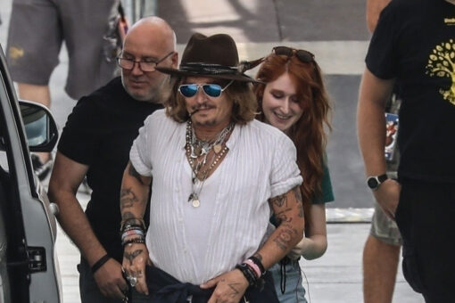 Johnny Depp’s redheaded mystery woman’s identity revealed