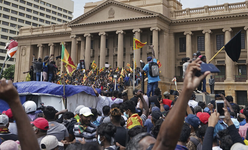 Sri Lanka president blocked by airport staff during attempt to flee country after protesters break into home