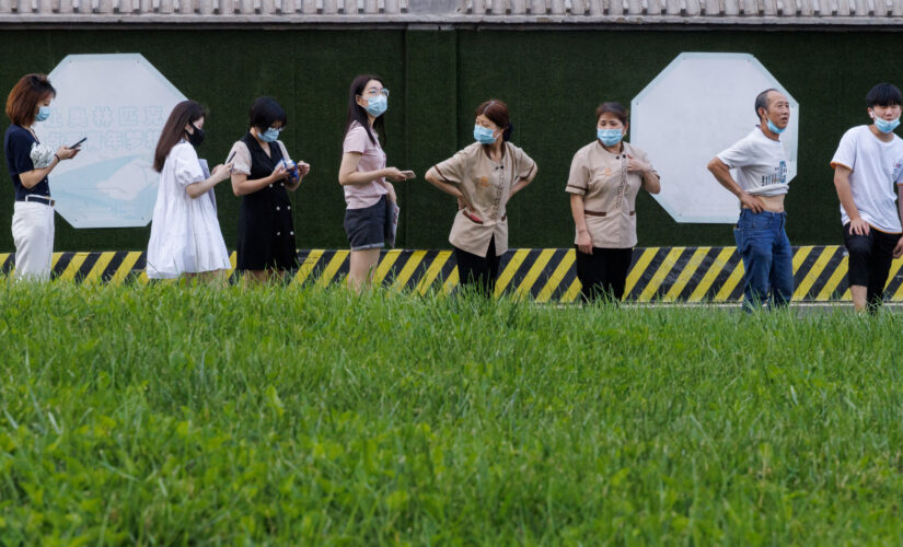 Beijing residents asked to wear monitoring bracelets to enforce COVID quarantine, prompting outcry