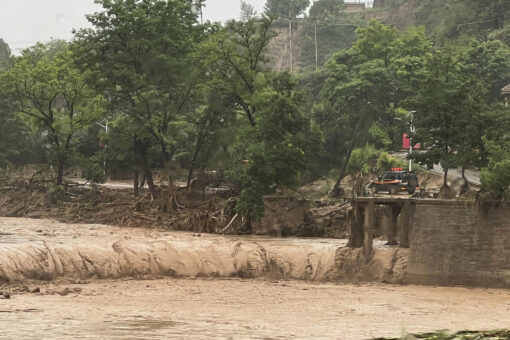 China floods leave at least 12 dead, thousands evacuated