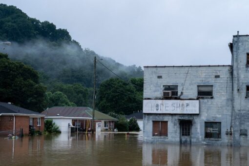 White House targets climate change as Joe Biden lands in Kentucky to survey flood damage