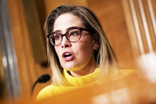 Progressive groups take aim at Sinema over decision to remove carried interest tax loophole from Manchin bill