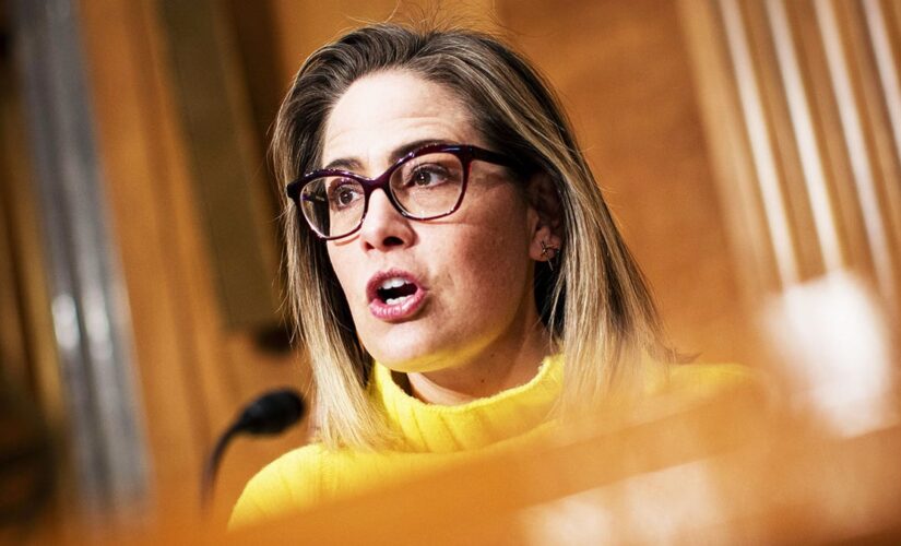 Progressive groups take aim at Sinema over decision to remove carried interest tax loophole from Manchin bill