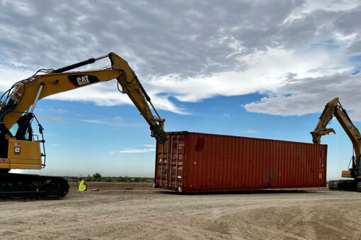 Arizona gov begins sealing gaps in border wall with shipping containers topped with razor wire