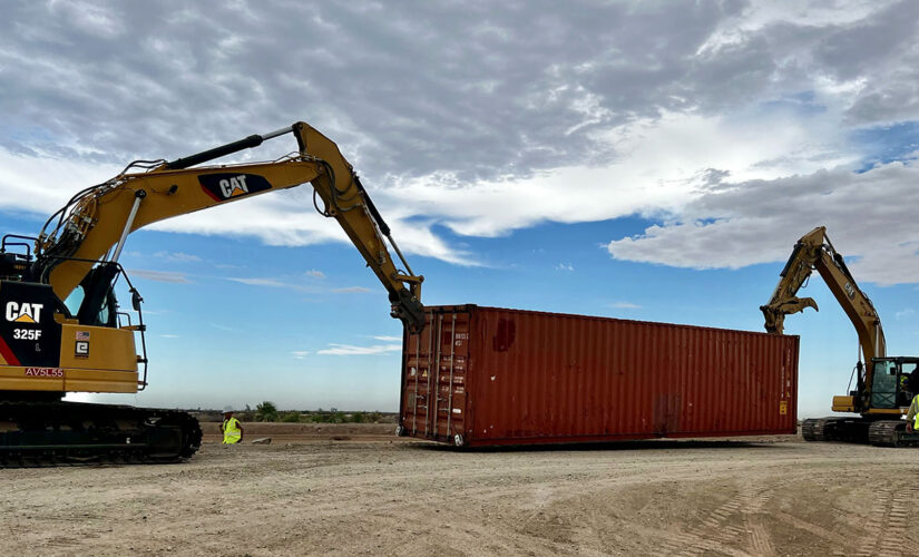 Arizona gov begins sealing gaps in border wall with shipping containers topped with razor wire