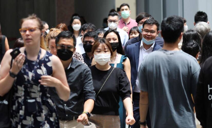 Singapore to cut almost all indoor mask requirements as COVID settles