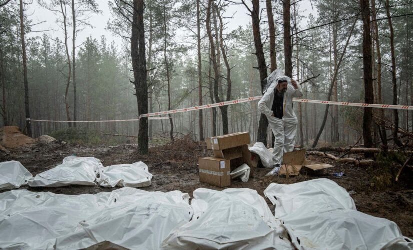 Top Ukraine official says 450 bodies found in Izyum mass grave, some with hands tied behind their backs