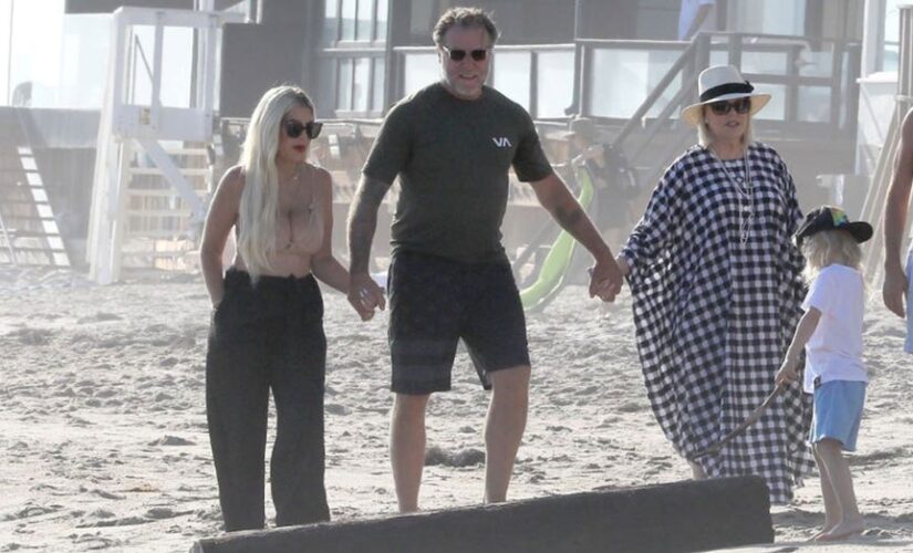Tori Spelling, Dean McDermott and Candy Spelling hold hands during beach outing as couple is ‘co-parenting’