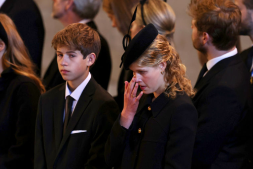 Queen II’s youngest grandchild, James, Viscount Severn, 14, stands vigil at her coffin