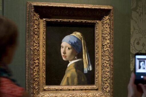 Climate activist glues his head to ‘Girl with a Pearl Earring’ painting in The Hague