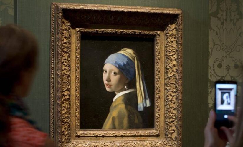 Climate activist glues his head to ‘Girl with a Pearl Earring’ painting in The Hague