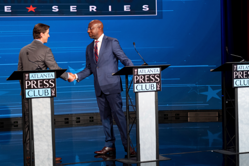 Raphael Warnock debates Libertarian Chase Oliver as Herschel Walker declines invitation