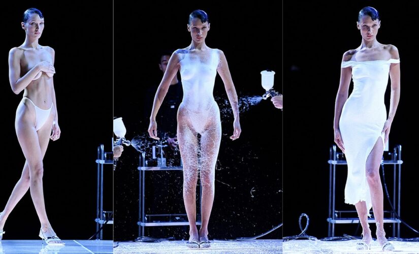 Bella Hadid struts runway topless, then gets white dress spray-painted for Paris Fashion Week