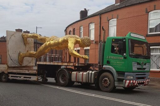 British locals up in arms as naked golden statue retired for the winter