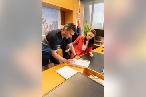 New Zealand PM, political rival sign and auction hot mic insult to raise money ‘for p—-s everywhere’
