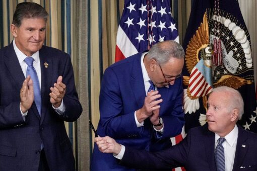 Biden backs adding Manchin’s energy bill to defense legislation despite progressive opposition